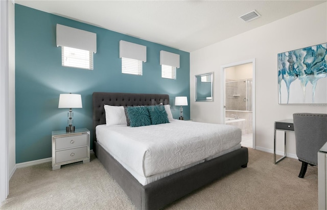 carpeted bedroom featuring connected bathroom