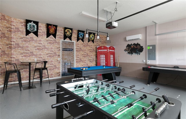 playroom with pool table, a wall mounted AC, brick wall, electric panel, and a textured ceiling