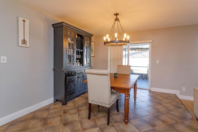 dining space featuring an inviting chandelier