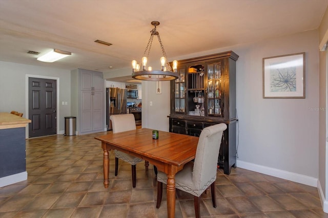 dining room featuring an inviting chandelier