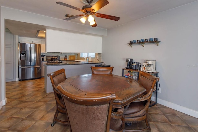 dining room featuring ceiling fan