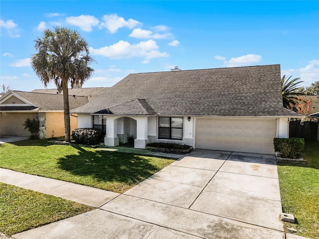 ranch-style home with a front yard and a garage