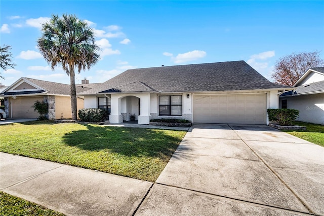 single story home with a front yard and a garage