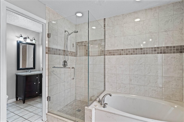 bathroom with tile patterned flooring, a textured ceiling, shower with separate bathtub, and vanity