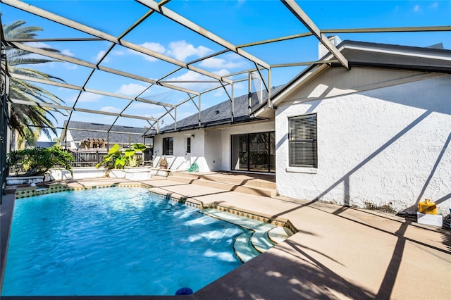 view of swimming pool with a lanai, a patio, and pool water feature