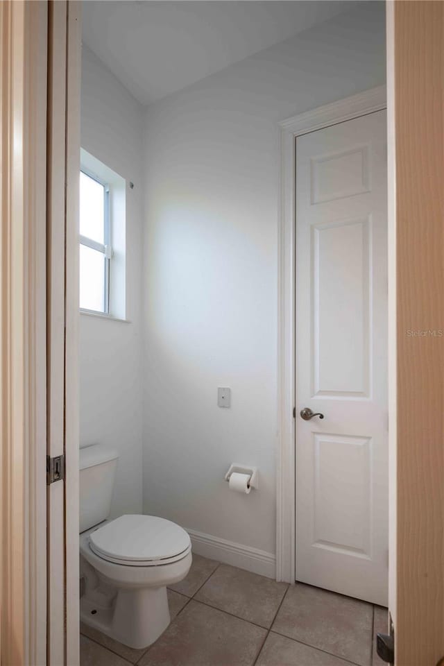 bathroom featuring tile patterned floors and toilet