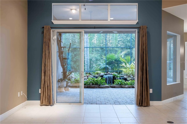 doorway to outside featuring light tile patterned floors