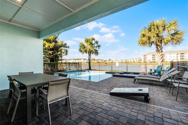 view of pool featuring an in ground hot tub and a patio