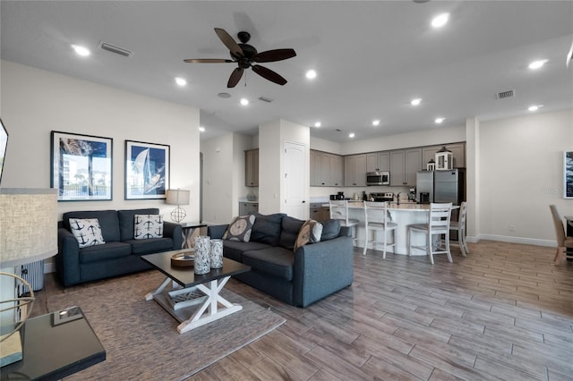 living room with ceiling fan