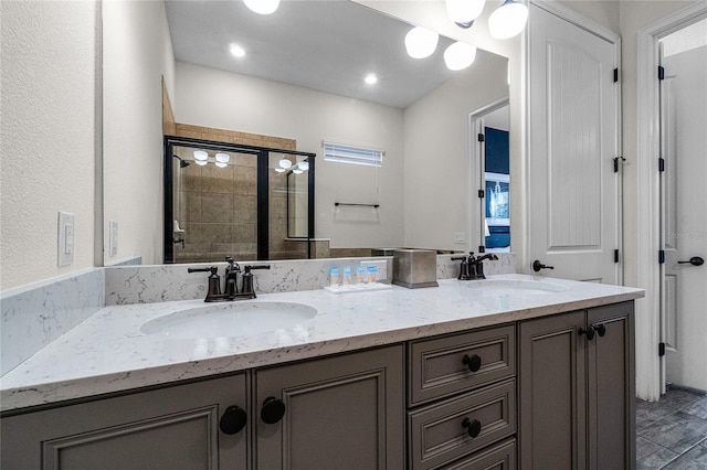 bathroom featuring vanity, wood-type flooring, and a shower with door