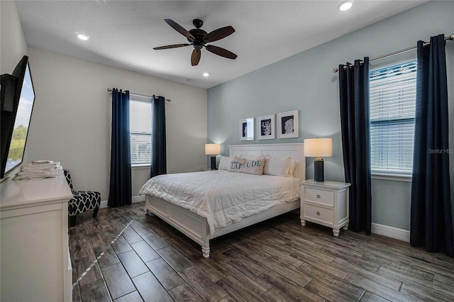 bedroom with multiple windows and ceiling fan