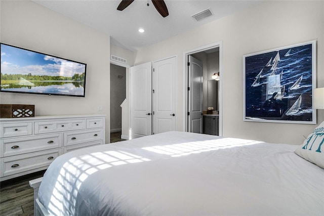 bedroom featuring connected bathroom, ceiling fan, and dark hardwood / wood-style floors