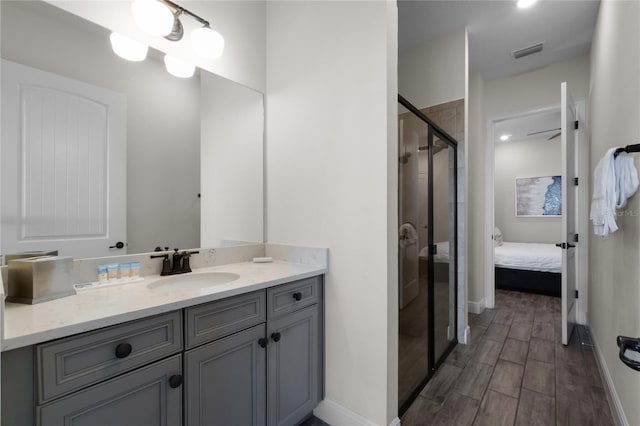 bathroom with vanity and walk in shower