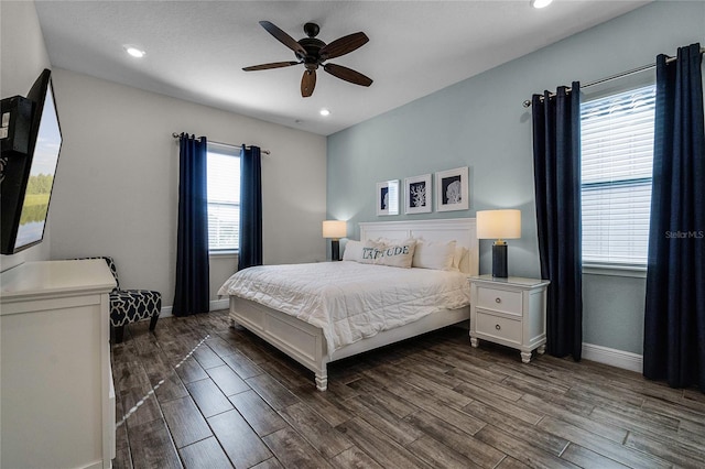 bedroom with multiple windows and ceiling fan