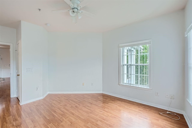 empty room featuring ceiling fan and light wood-type flooring