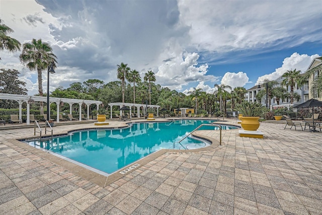 view of swimming pool featuring a patio area