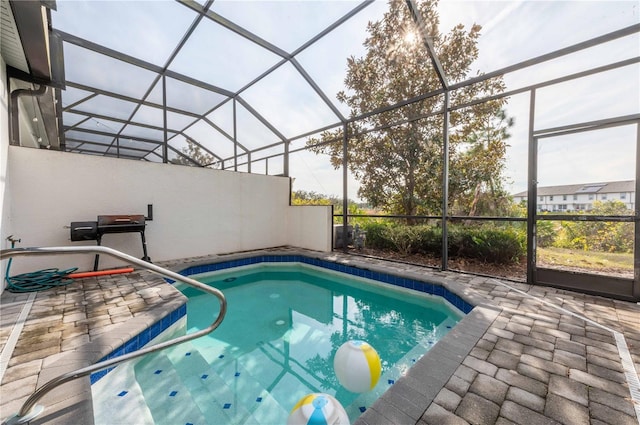 view of pool with a lanai and a patio area