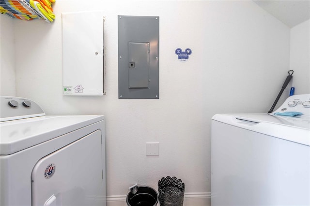 laundry room featuring washing machine and clothes dryer and electric panel