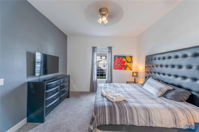 bedroom featuring light colored carpet and ceiling fan