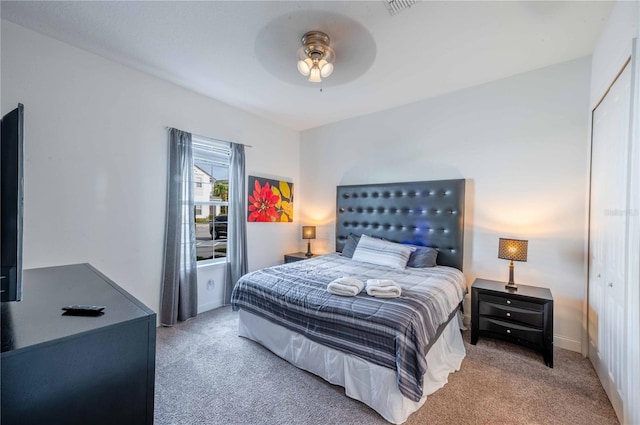 carpeted bedroom featuring ceiling fan