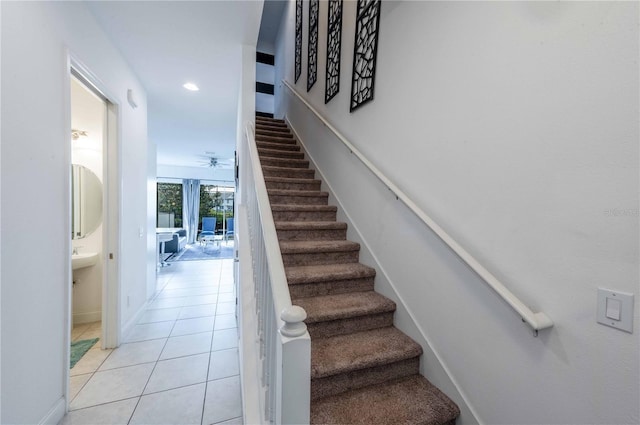 stairs featuring tile patterned floors