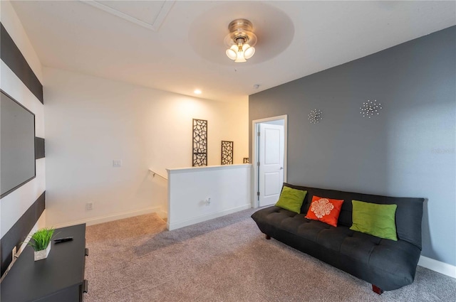 carpeted living room featuring ceiling fan