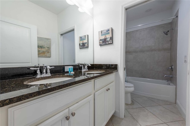 full bathroom featuring vanity, tile patterned floors, tiled shower / bath combo, and toilet