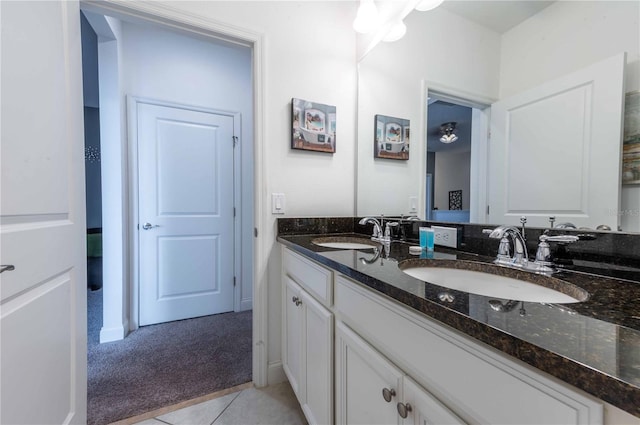 bathroom featuring tile patterned flooring and vanity