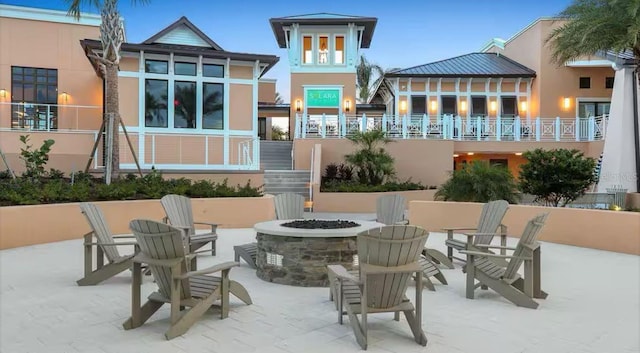 view of patio / terrace with an outdoor fire pit