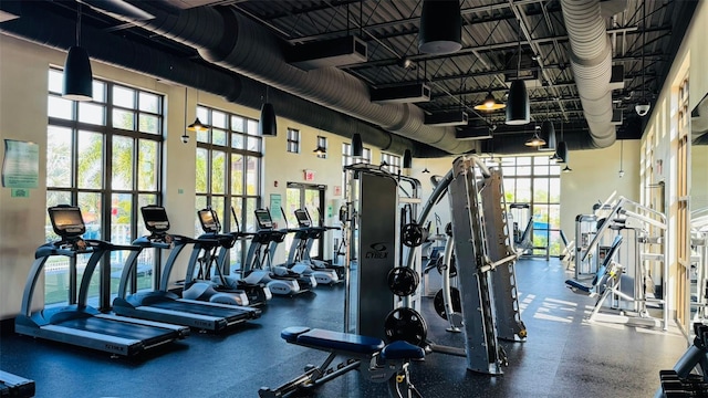 gym with a towering ceiling