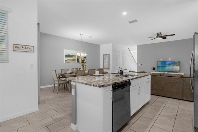 kitchen with sink, decorative light fixtures, white cabinetry, dishwashing machine, and a kitchen island with sink