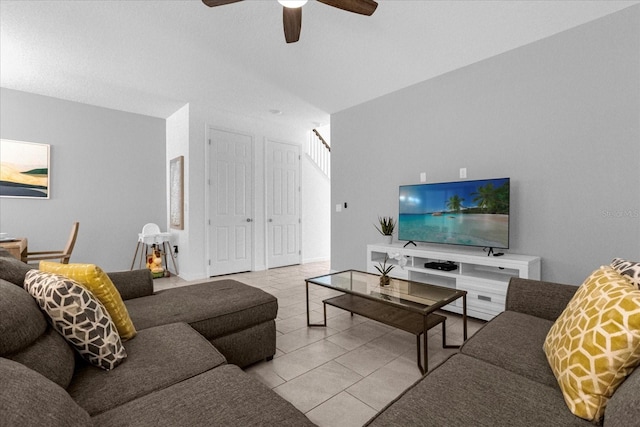 living room with ceiling fan and light tile patterned floors