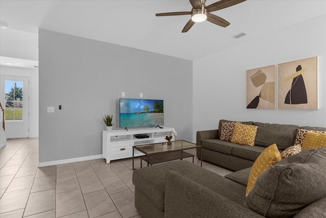 living room featuring ceiling fan and light tile patterned floors