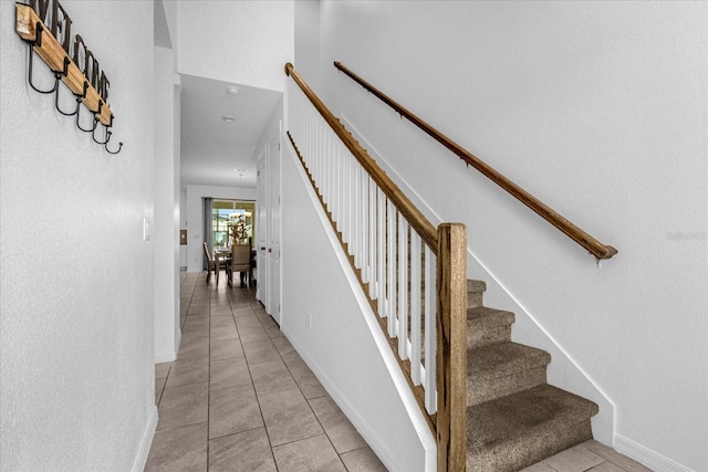 stairs with tile patterned flooring