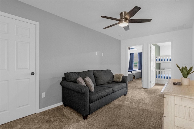 living room with carpet floors and ceiling fan