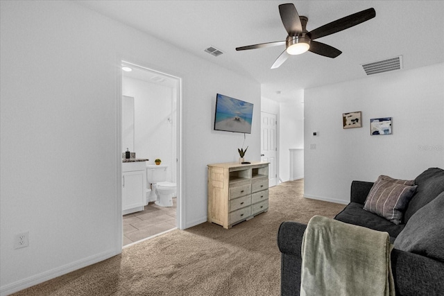 living room featuring light carpet and ceiling fan