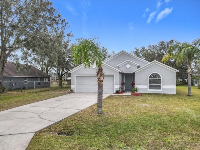 ranch-style home with a garage and a front lawn