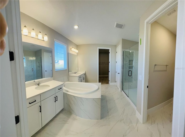 bathroom featuring separate shower and tub and vanity