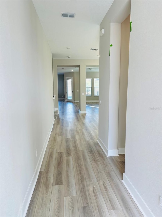 corridor featuring light hardwood / wood-style floors