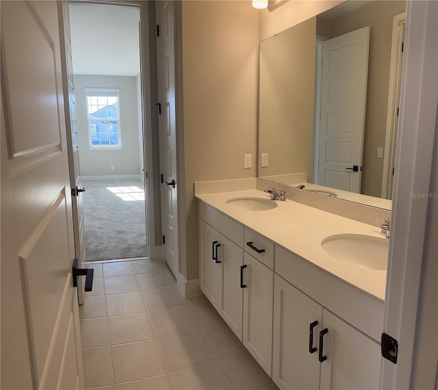 bathroom with tile patterned flooring and vanity