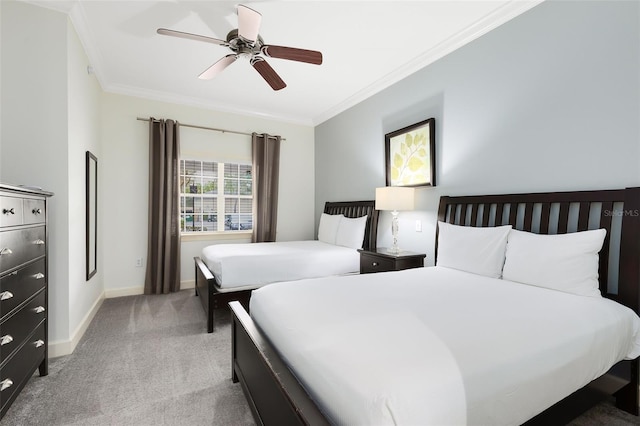 bedroom featuring ornamental molding, ceiling fan, and light colored carpet