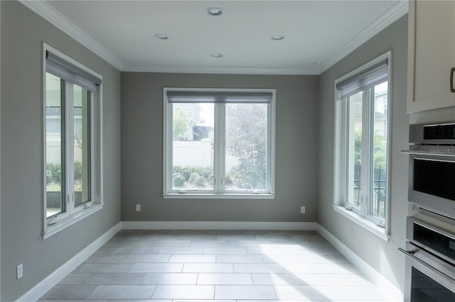 unfurnished dining area featuring crown molding and a healthy amount of sunlight