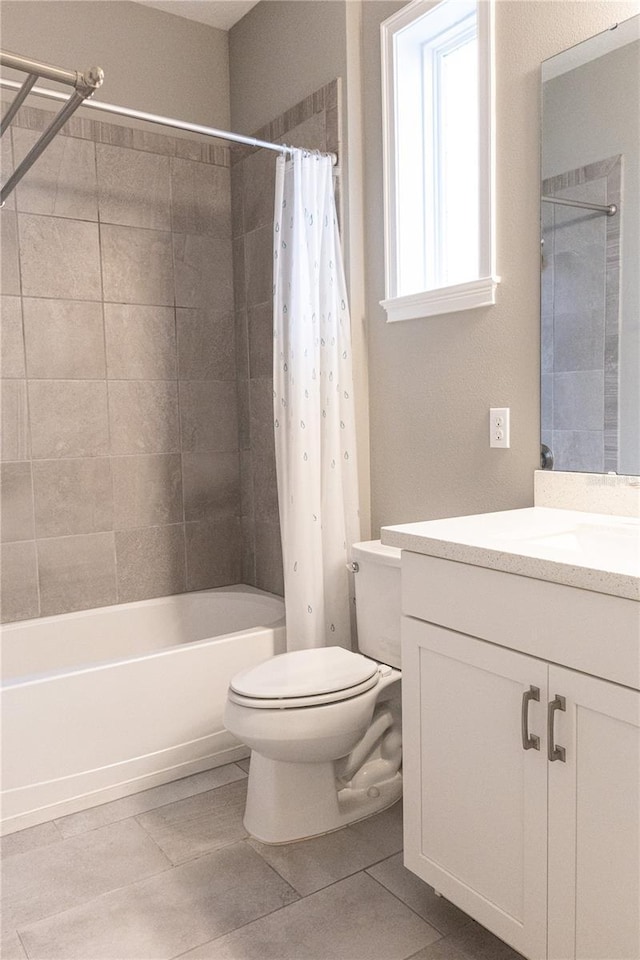 full bathroom with vanity, toilet, tile patterned floors, and shower / bath combo with shower curtain