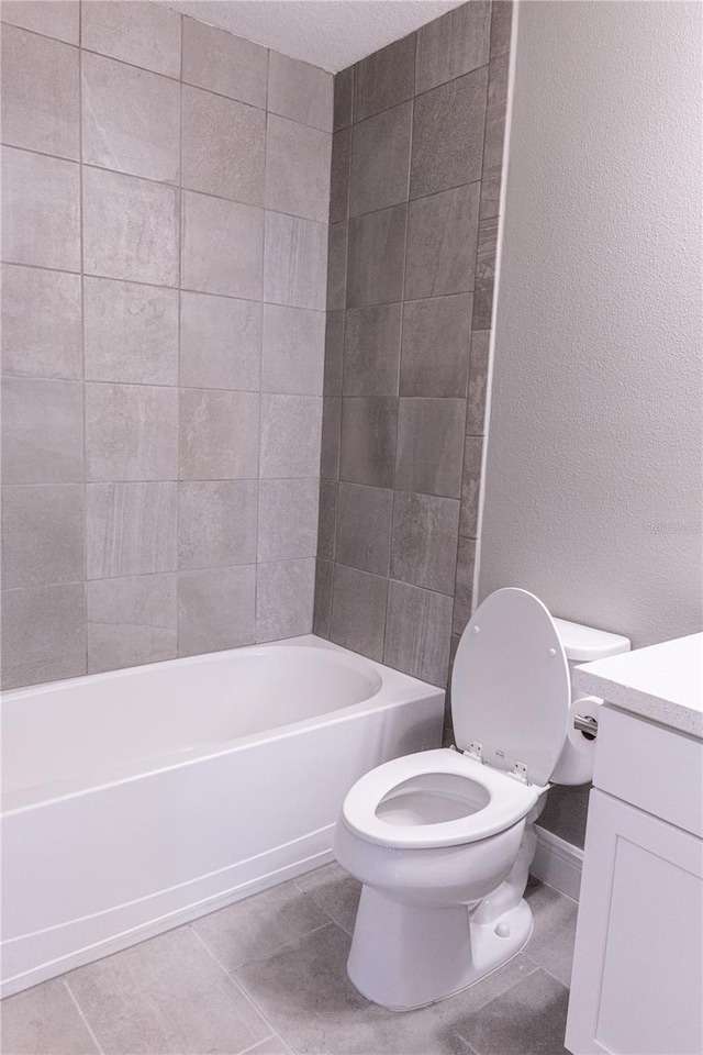 full bathroom with vanity, toilet, bathing tub / shower combination, and tile patterned flooring