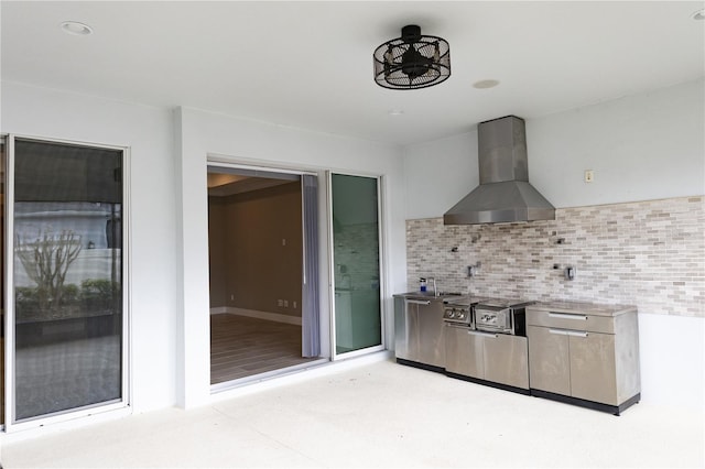 kitchen with wall chimney exhaust hood and decorative backsplash