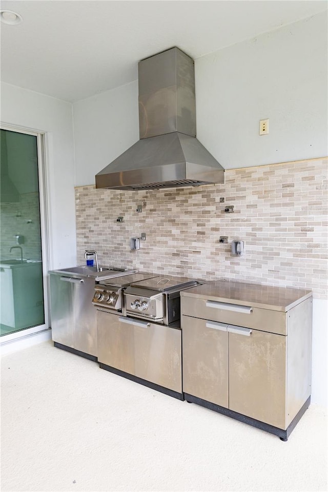 kitchen featuring decorative backsplash and island range hood