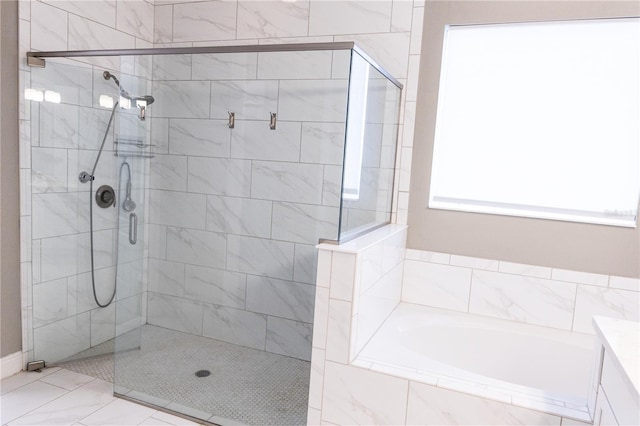 bathroom with shower with separate bathtub