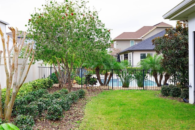 view of yard featuring a fenced in pool