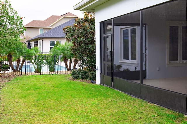 view of yard featuring a fenced in pool