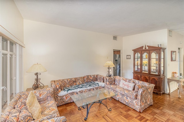 living room featuring parquet flooring